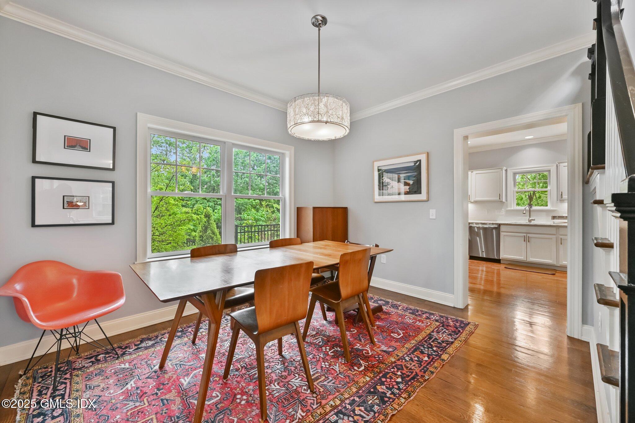 8 View Street, Unit 10 Greenwich, CT 06830 - Photo 7 of 26 a view of a dining room with furniture window and wooden floor