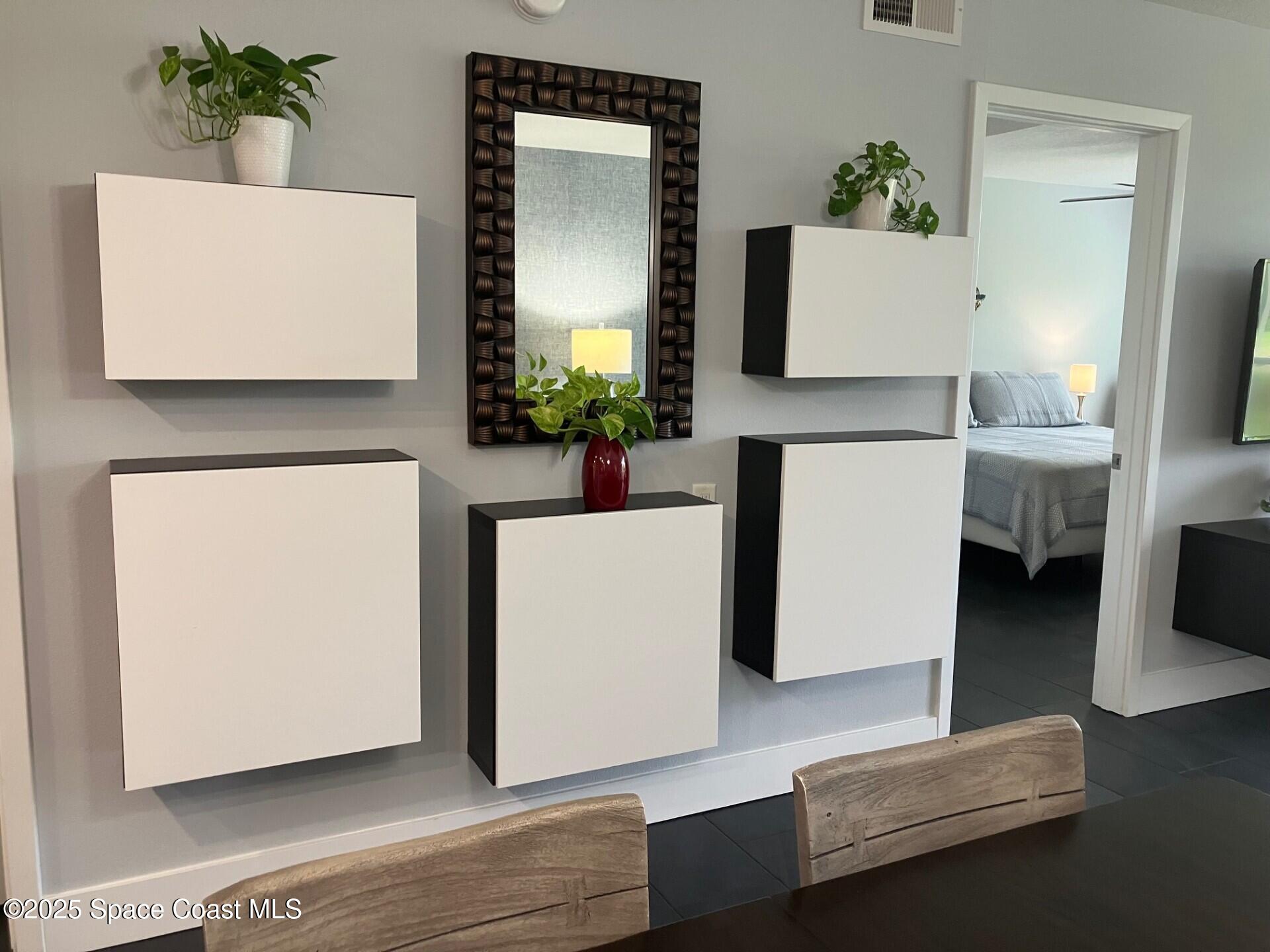 1420 Huntington Lane, Unit 2105 Rockledge, FL 32955 - Photo 16 of 24 a living room with furniture and a potted plant
