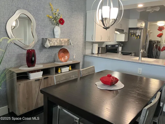 a very nice looking dining room with a table and chairs