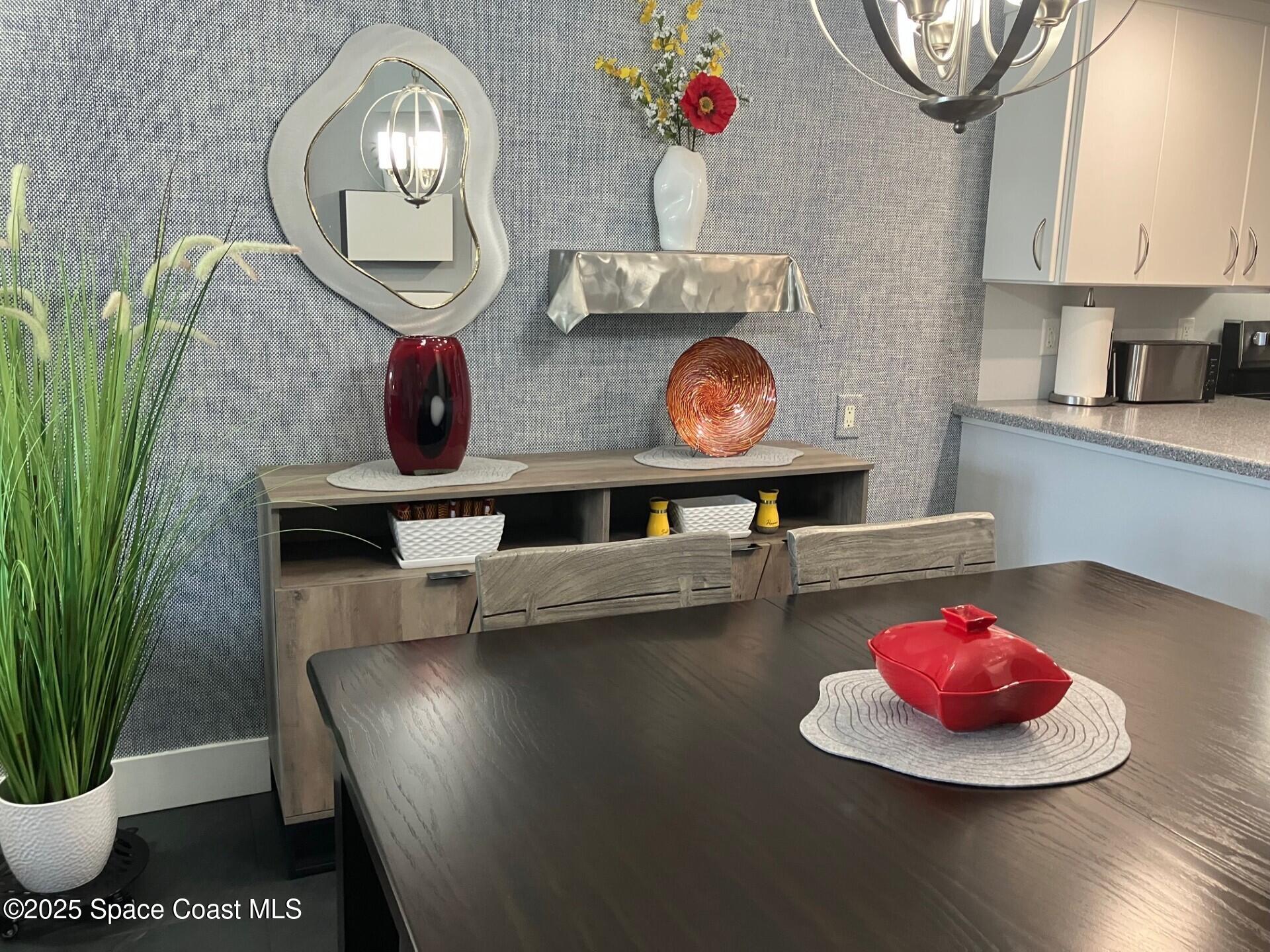 1420 Huntington Lane, Unit 2105 Rockledge, FL 32955 - Photo 20 of 24 a room with furniture and a wooden floor