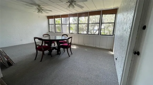 a kitchen with granite countertop a sink and cabinets