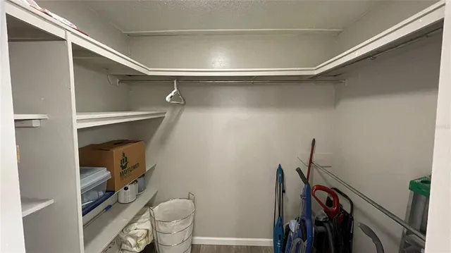 a room with wooden floor and glass door