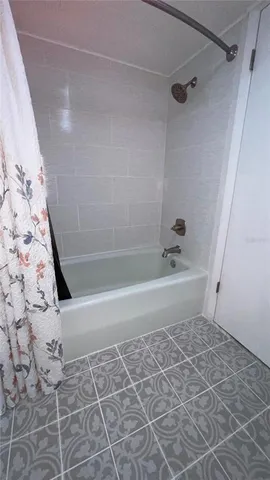 a view of a hallway with wooden door