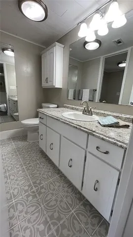 a view of swimming pool with outdoor seating and plants