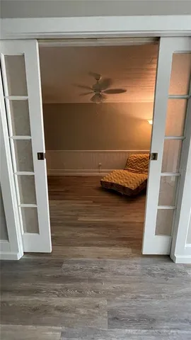 a front view of a house with swimming pool having outdoor seating