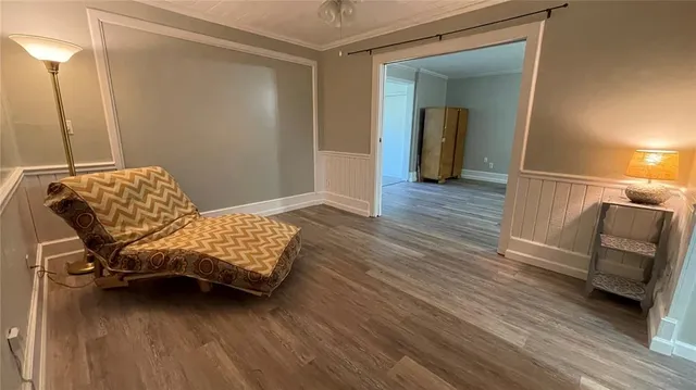 a view of a balcony with chair and wooden floor