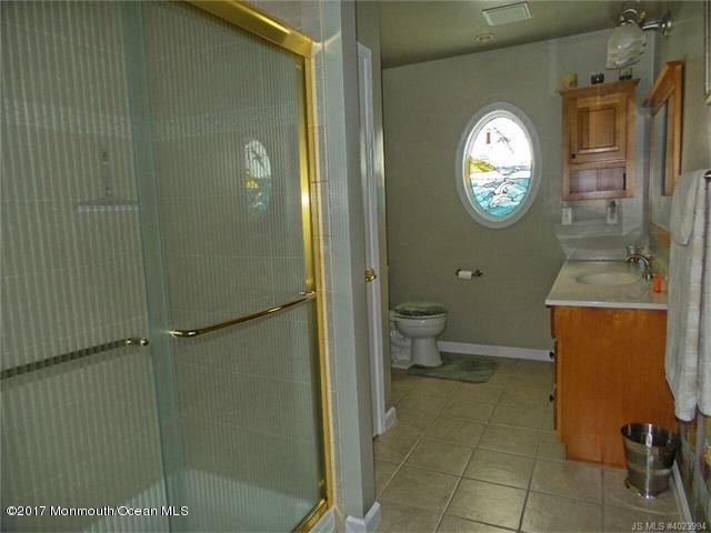 36 Diane Road Manahawkin, NJ 08050 - Photo 20 of 28 a bathroom with a toilet a sink and a shower