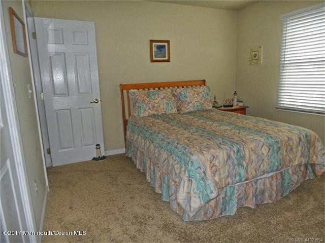 36 Diane Road Manahawkin, NJ 08050 - Photo 21 of 28 a bedroom with a bed and a window