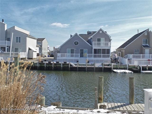 36 Diane Road Manahawkin, NJ 08050 - Photo 4 of 28 a front view of a house with a lake view and large trees