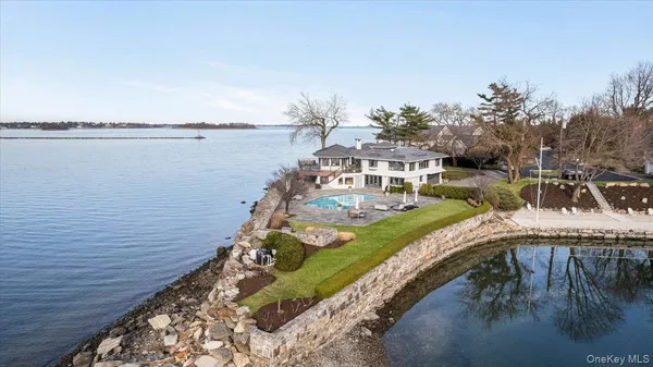 a view of a wooden deck and lake view