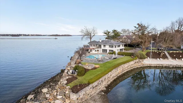 a view of a wooden deck and lake view