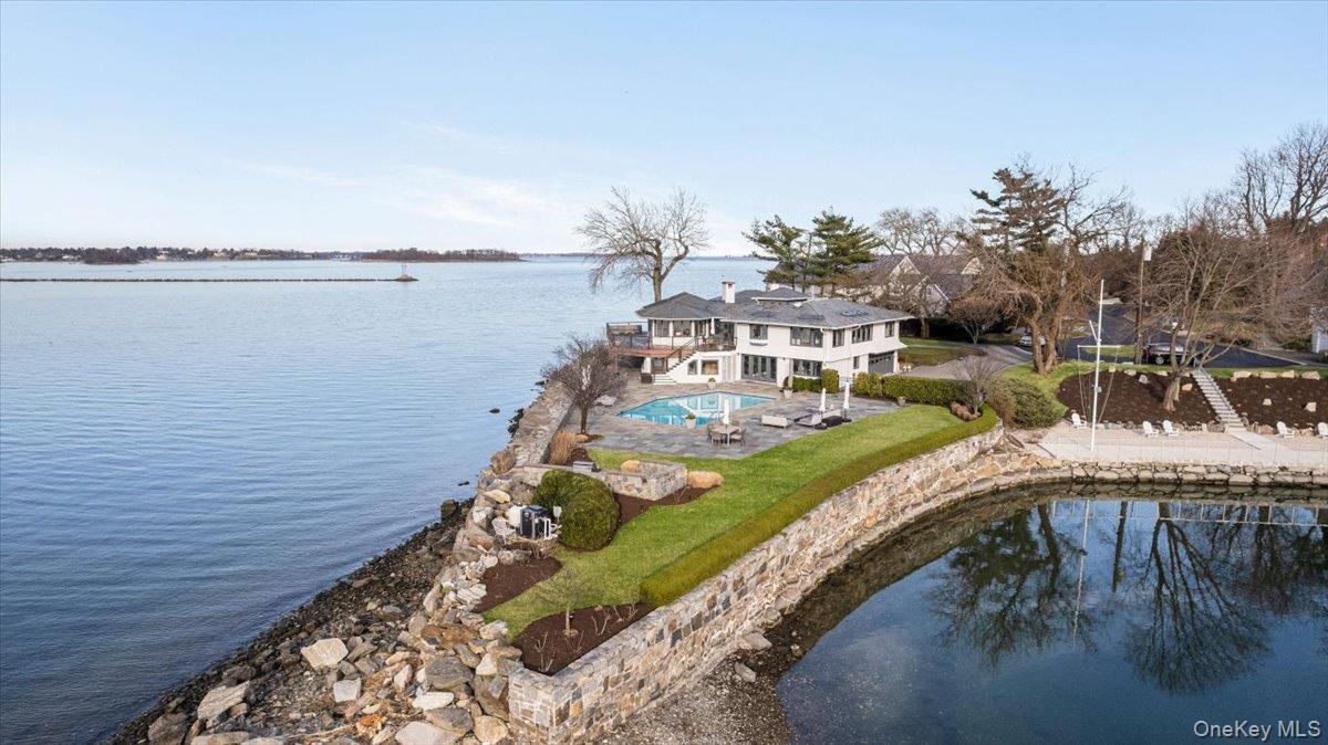 a view of a wooden deck and lake view