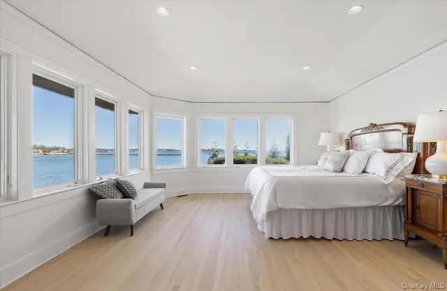 a spacious bathroom with a granite countertop tub sink and mirror