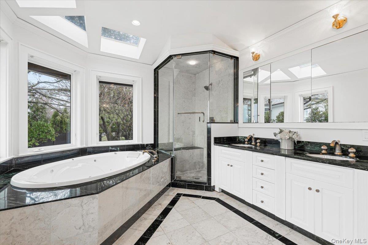 6 North Island Drive Rye, NY 10580 - Photo 14 of 34 a spacious bathroom with a granite countertop tub sink and mirror