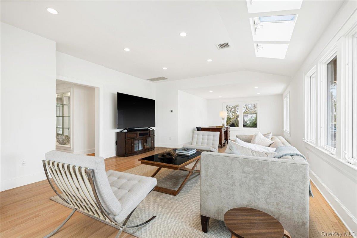 6 North Island Drive Rye, NY 10580 - Photo 16 of 34 a living room with furniture and a flat screen tv