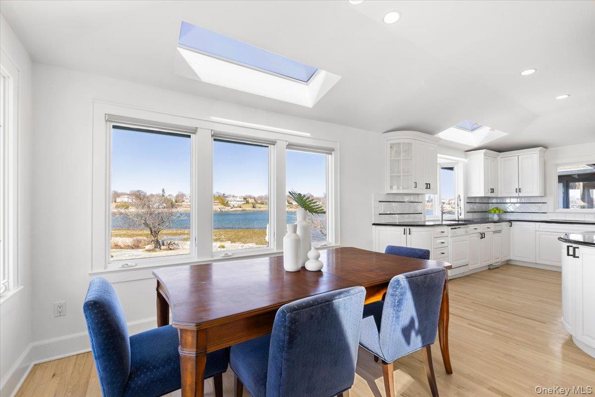 6 North Island Drive Rye, NY 10580 - Photo 18 of 34 a living room with stainless steel appliances kitchen island granite countertop furniture and a large window