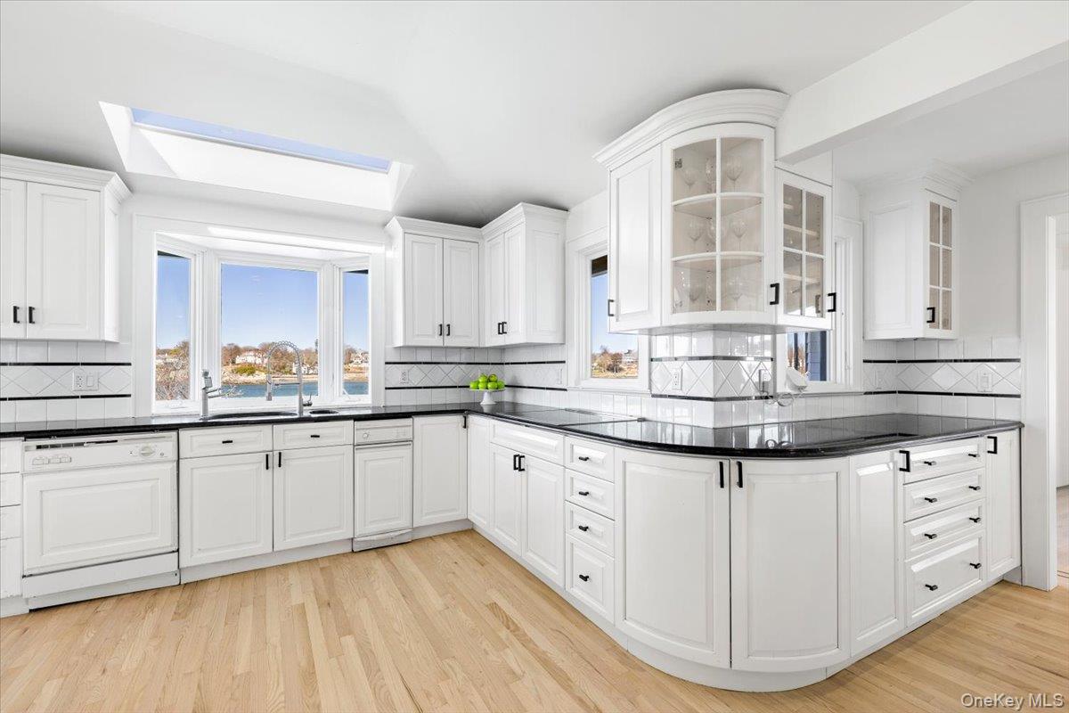 6 North Island Drive Rye, NY 10580 - Photo 34 of 34 a kitchen with granite countertop white cabinets and white appliances