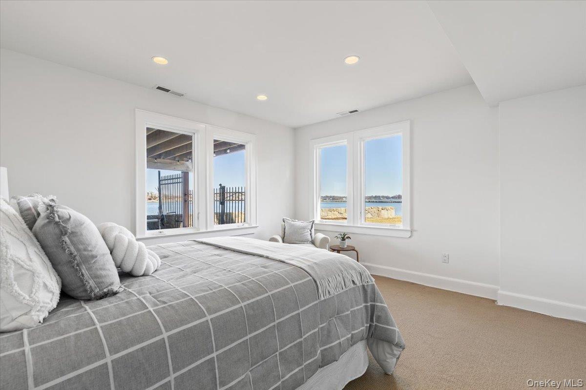 6 North Island Drive Rye, NY 10580 - Photo 22 of 34 a bedroom with a bed and a window