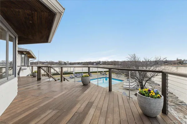 a view of a balcony with chairs