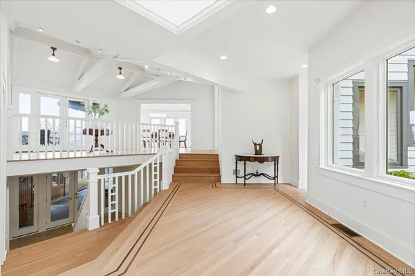 a spacious bathroom with a double vanity sink and a large mirror