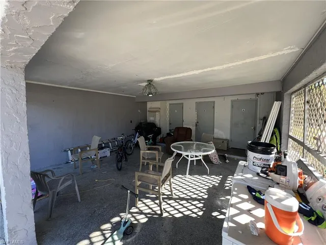 a view of building with car parked