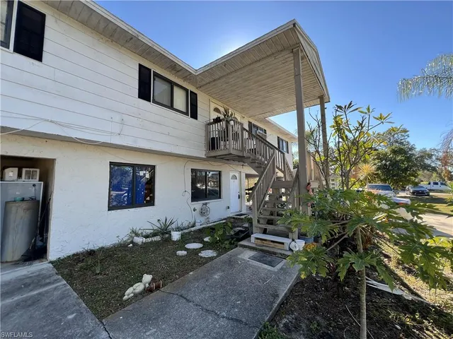 a view of a yard with snow on the road