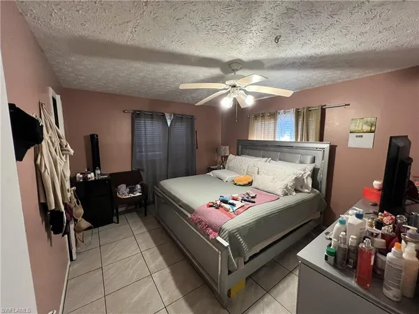 a bed room with a bed window and a couch