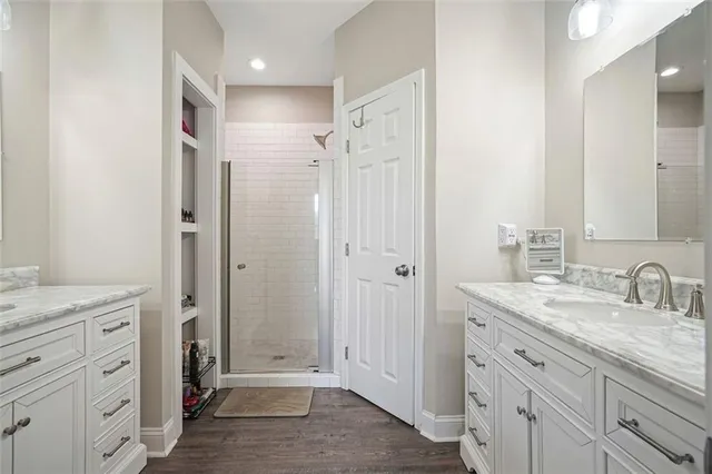 a bathroom with a granite countertop sink mirror and double