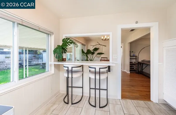 a dining room with furniture and window