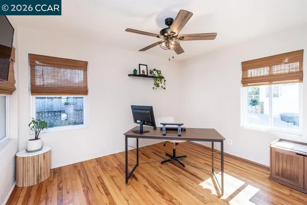 a workspace with furniture and window