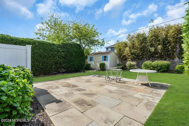 a view of patio with a garden