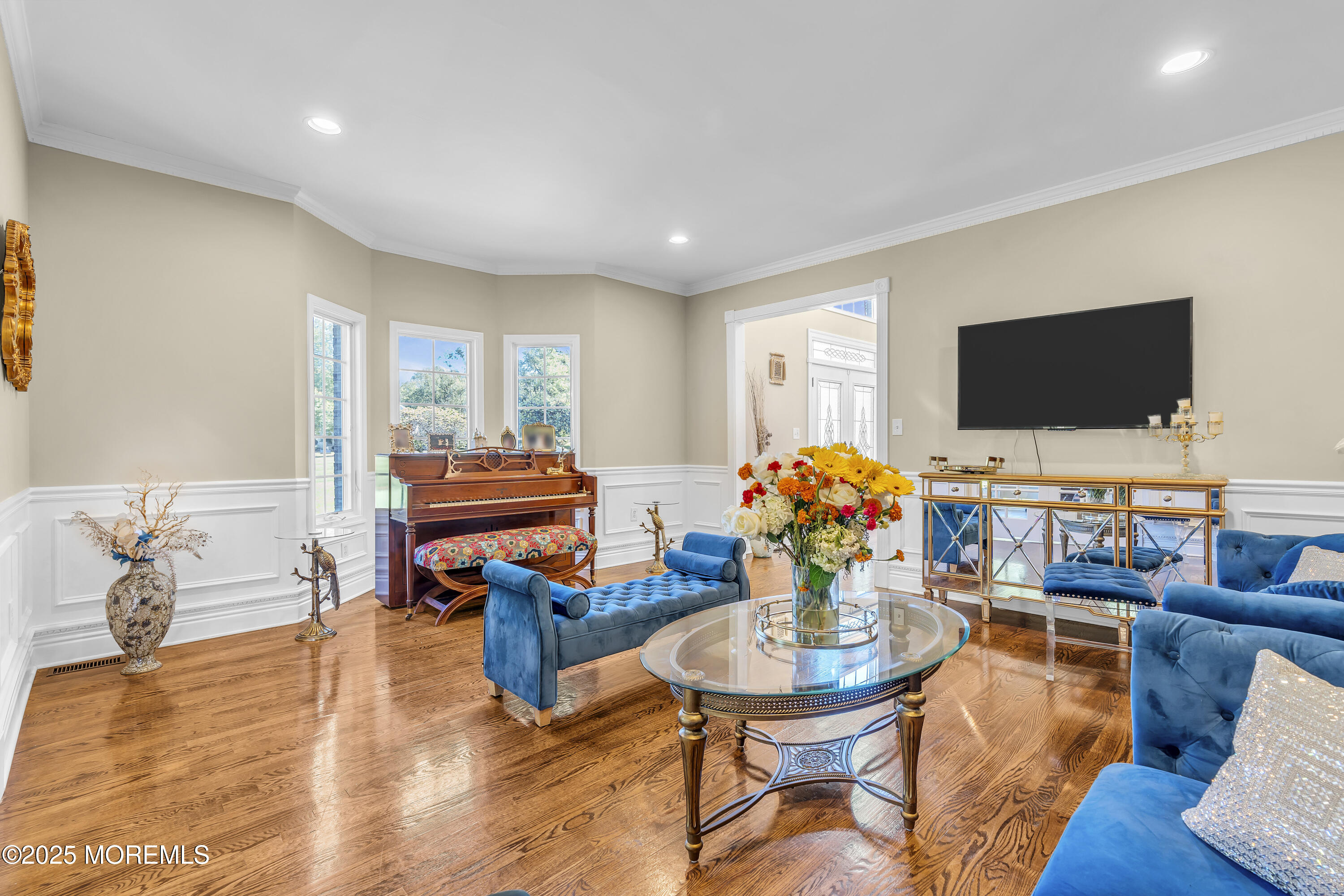 1 Fountayne Lane Manalapan, NJ 07726 - Photo 11 of 69 a living room with furniture and a flat screen tv