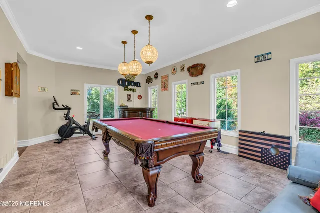 a view of a dining room with furniture wooden floor and chandelier