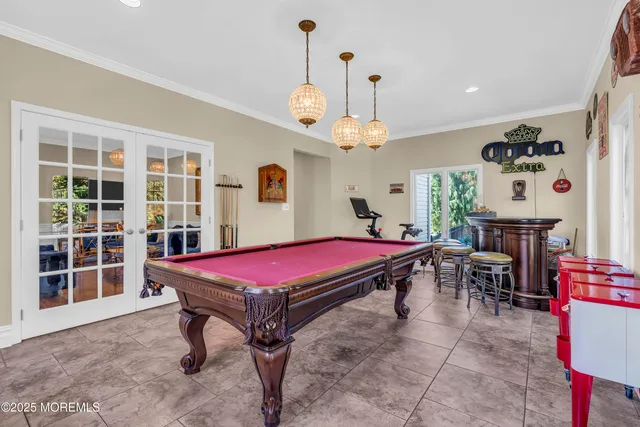 a view of a dining room with furniture wooden floor and chandelier