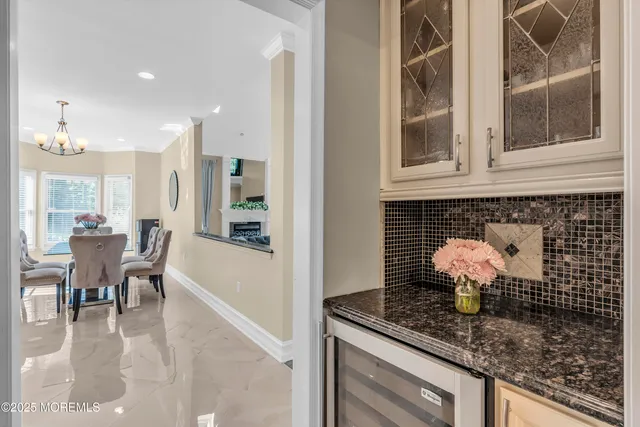 a large kitchen with granite countertop a stove and a sink