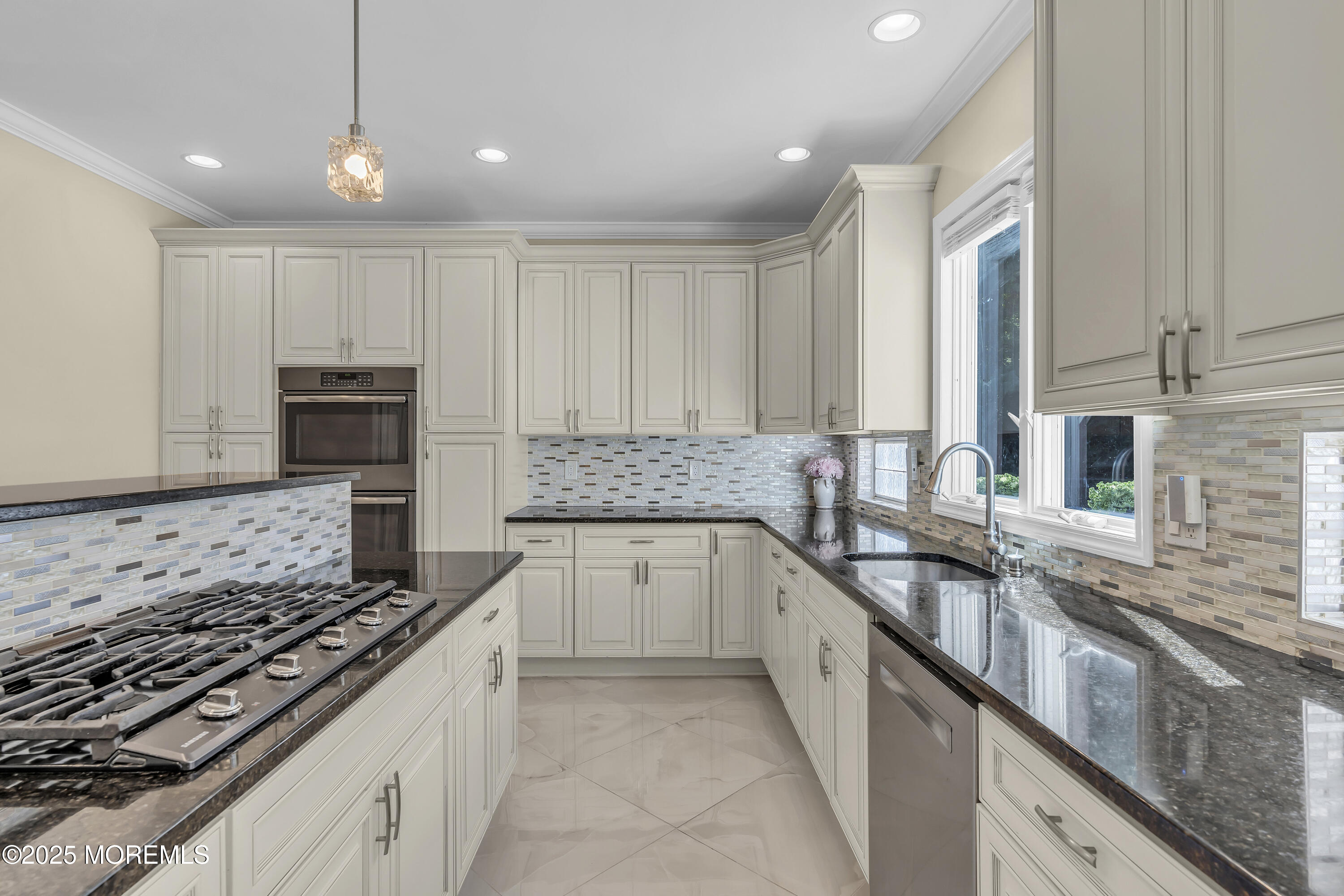 1 Fountayne Lane Manalapan, NJ 07726 - Photo 23 of 69 a large kitchen with granite countertop a stove and a sink