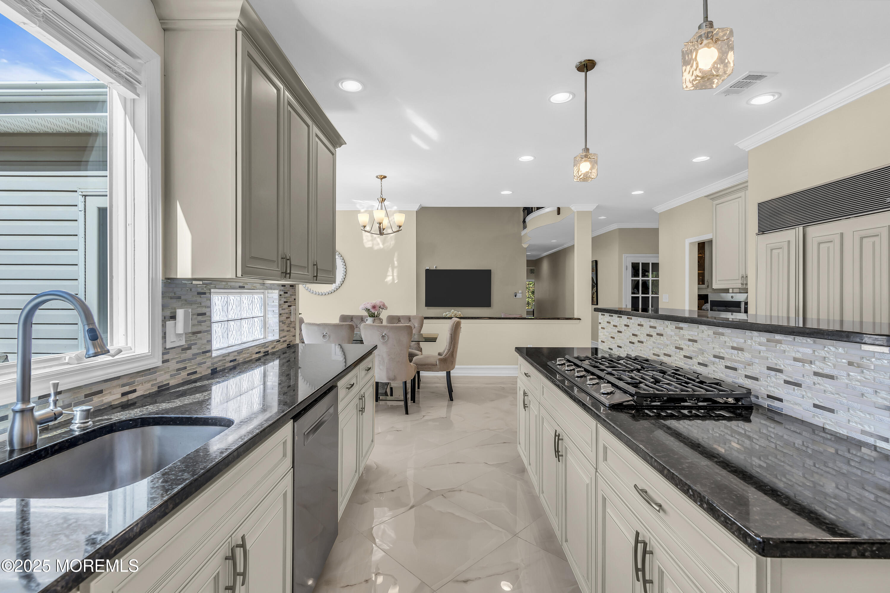1 Fountayne Lane Manalapan, NJ 07726 - Photo 25 of 69 a kitchen with stainless steel appliances a sink a stove top oven a counter space and a window