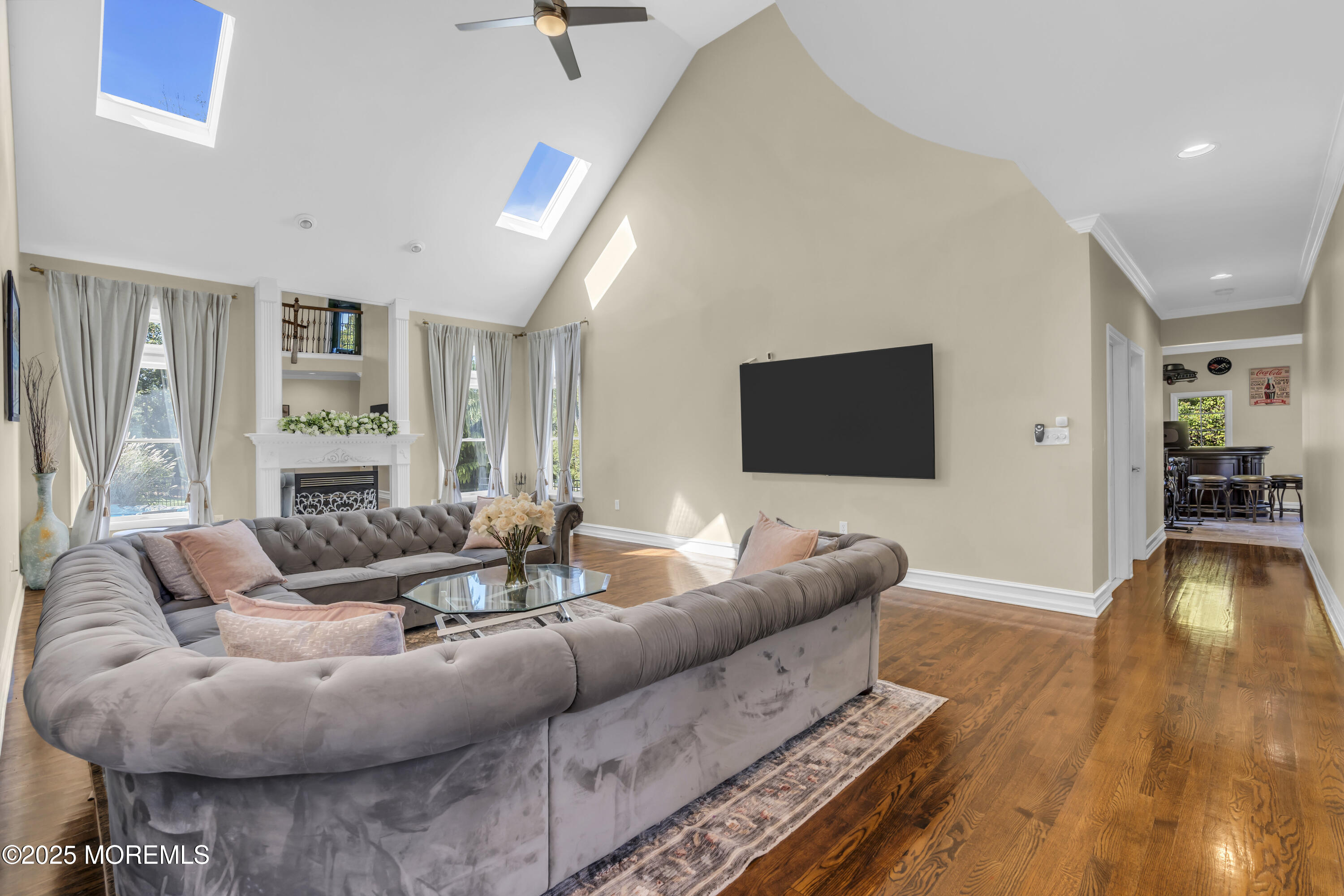 1 Fountayne Lane Manalapan, NJ 07726 - Photo 28 of 69 a living room with furniture and a flat screen tv