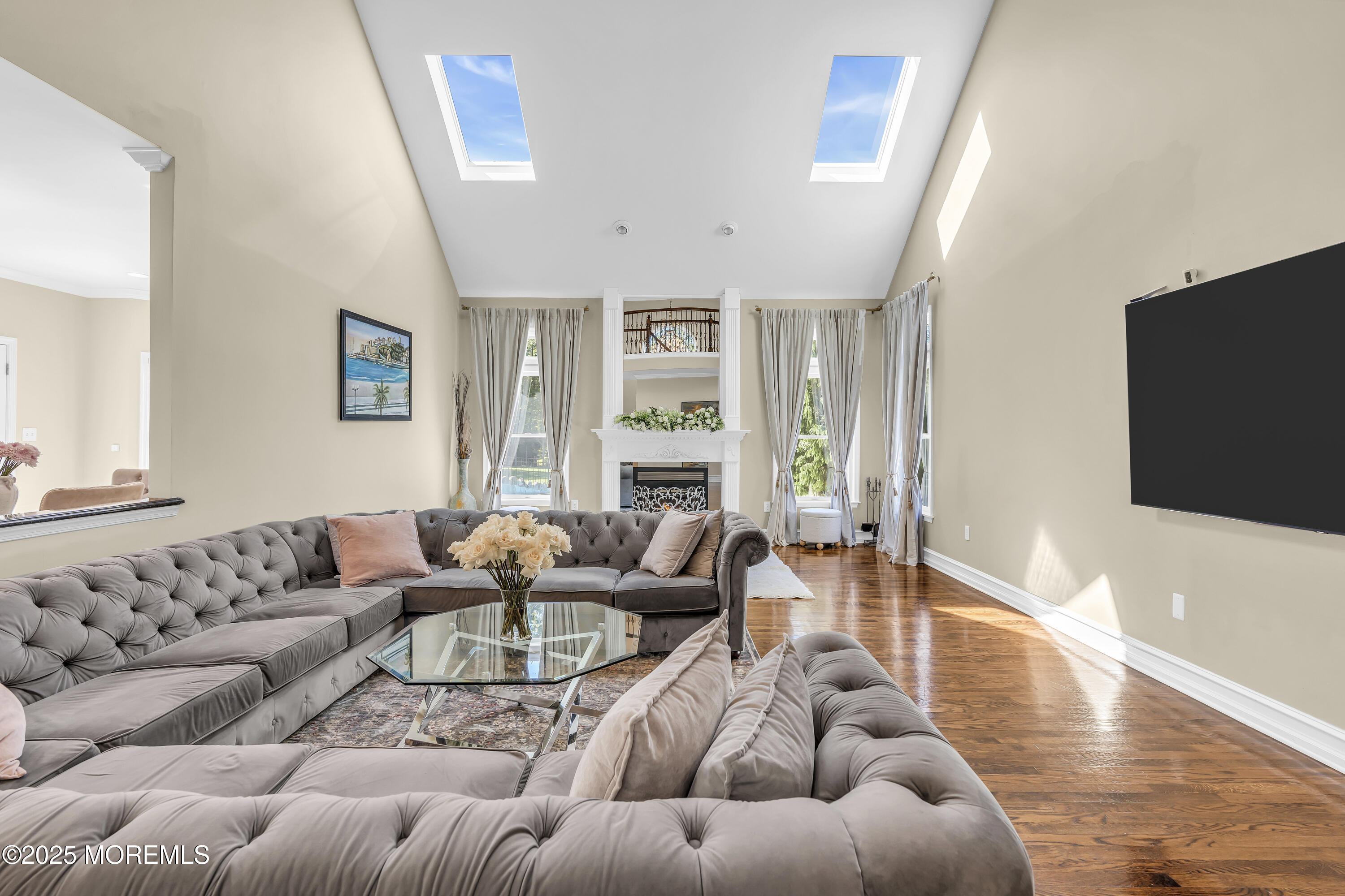 1 Fountayne Lane Manalapan, NJ 07726 - Photo 30 of 69 a living room with furniture and a flat screen tv