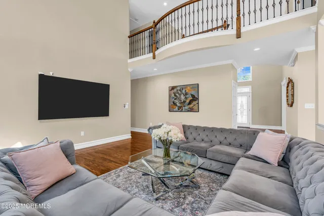 a living room with furniture window and wooden floor
