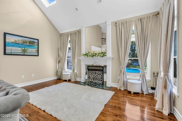 a bathroom with a granite countertop sink a mirror a shower and a bathtub
