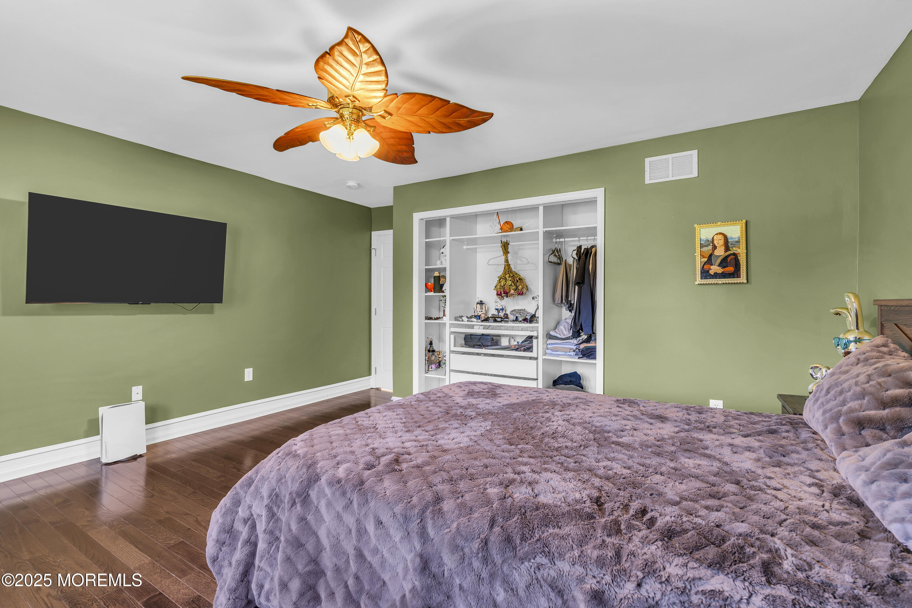 1 Fountayne Lane Manalapan, NJ 07726 - Photo 38 of 69 a bedroom with a bed and a flat screen tv