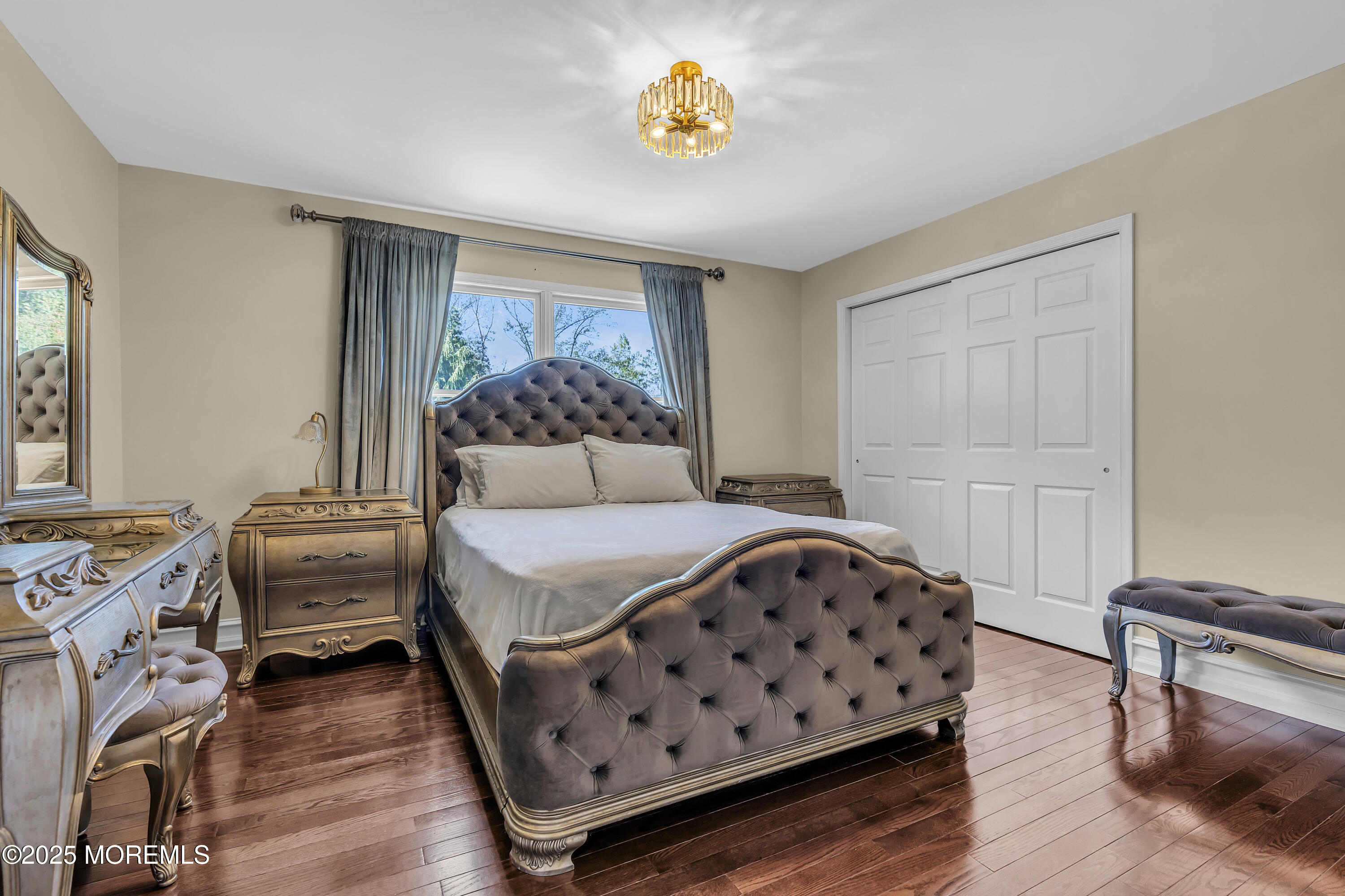 1 Fountayne Lane Manalapan, NJ 07726 - Photo 40 of 69 a bedroom with a bed and wooden floor