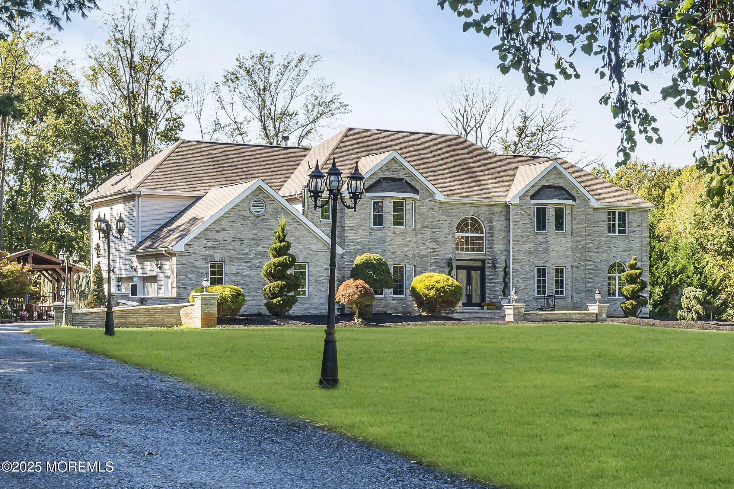 1 Fountayne Lane Manalapan, NJ 07726 - Photo 4 of 69 a front view of house with garden