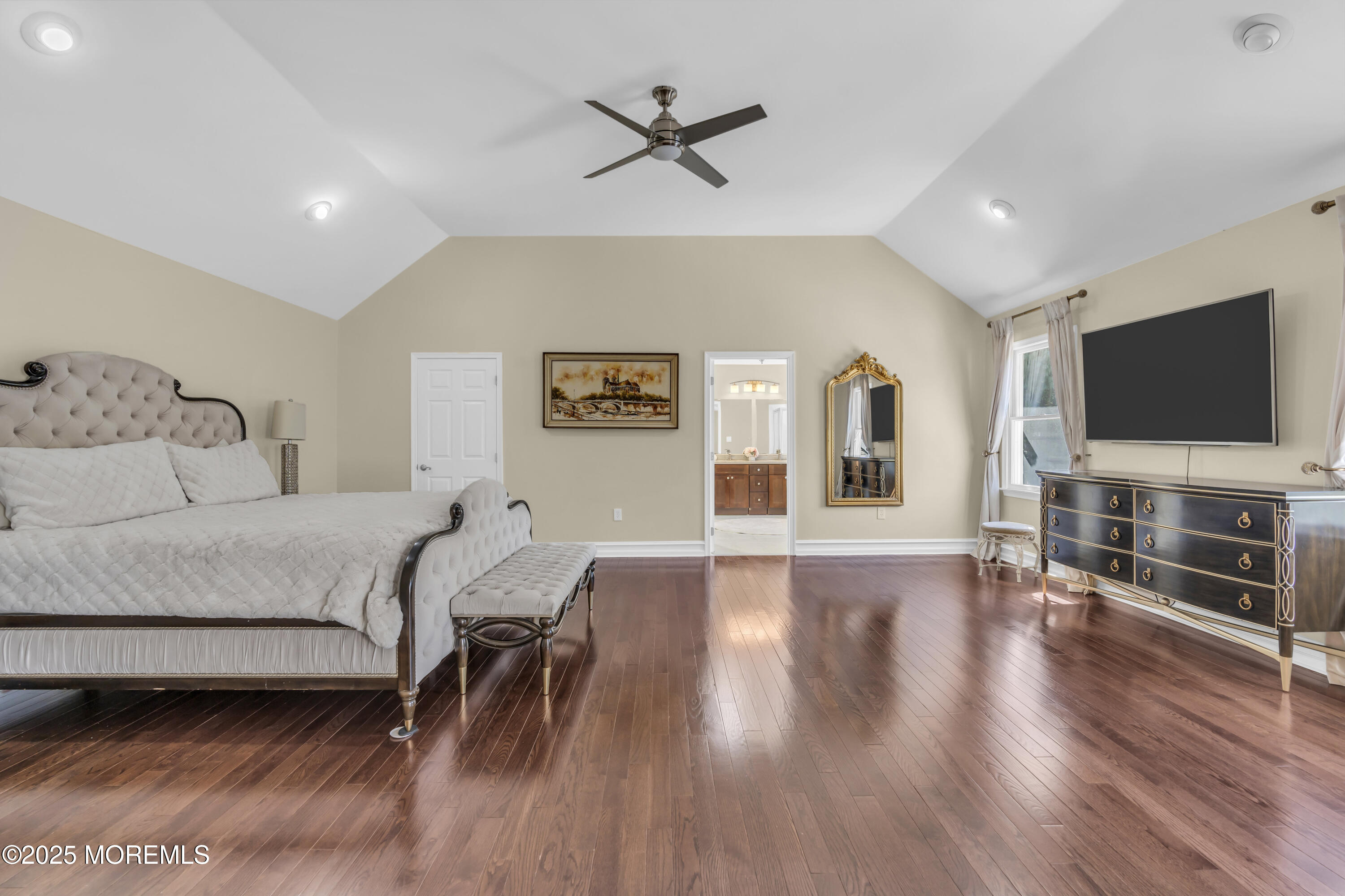 1 Fountayne Lane Manalapan, NJ 07726 - Photo 44 of 69 a living room with furniture and a flat screen tv