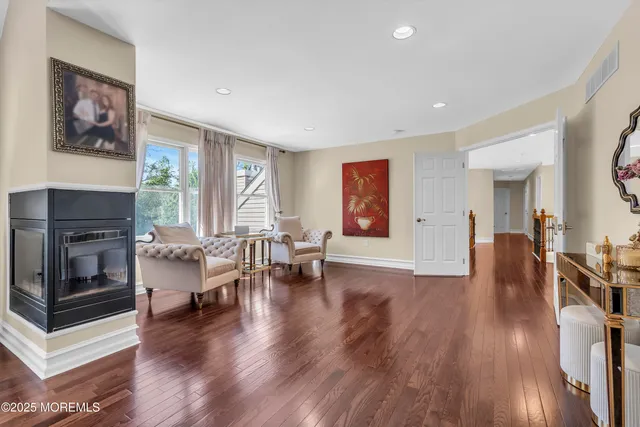 a view of a patio with couches chairs and a big yard