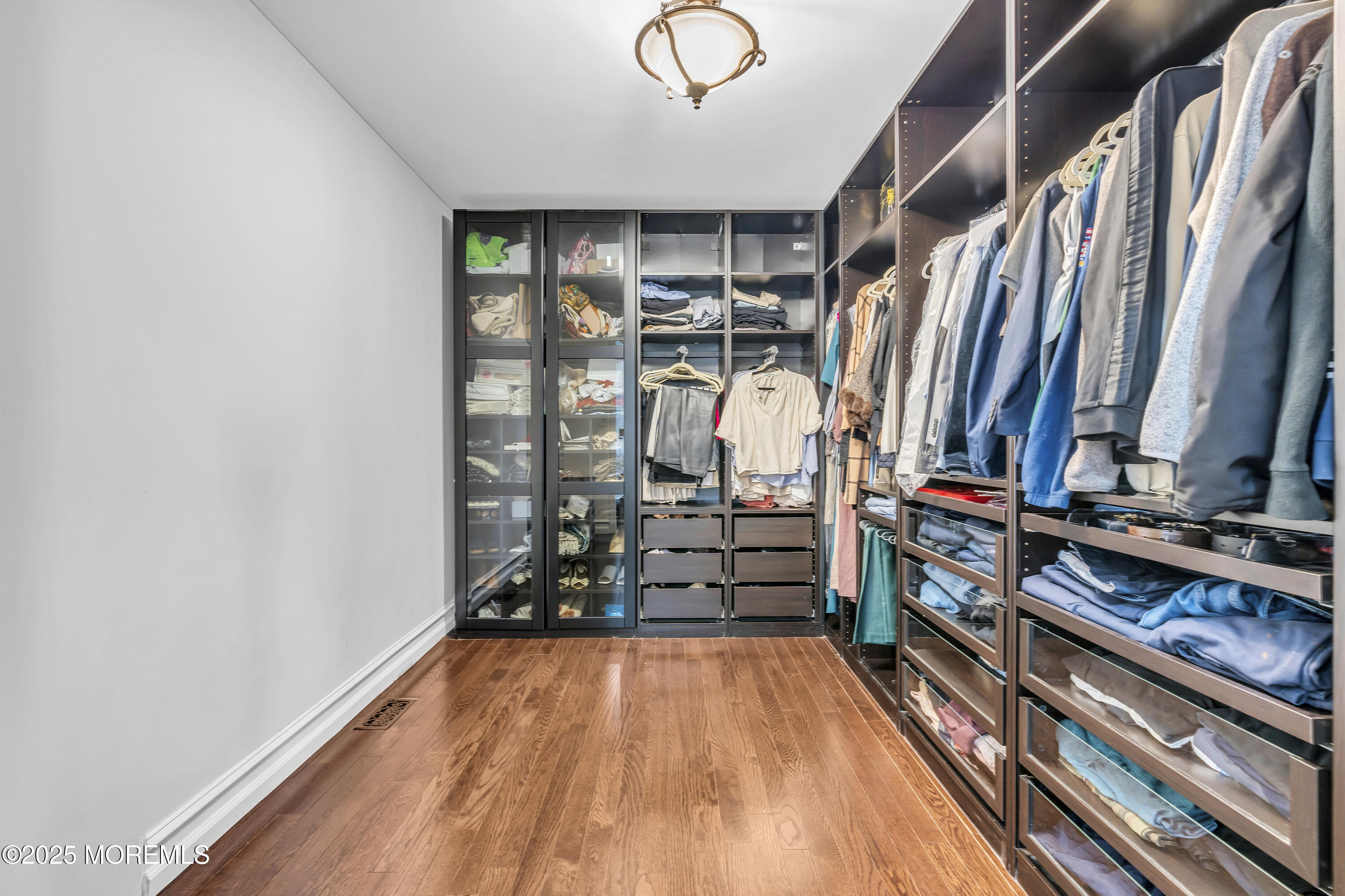 1 Fountayne Lane Manalapan, NJ 07726 - Photo 47 of 69 a view of walk in closet with clothes and shoes