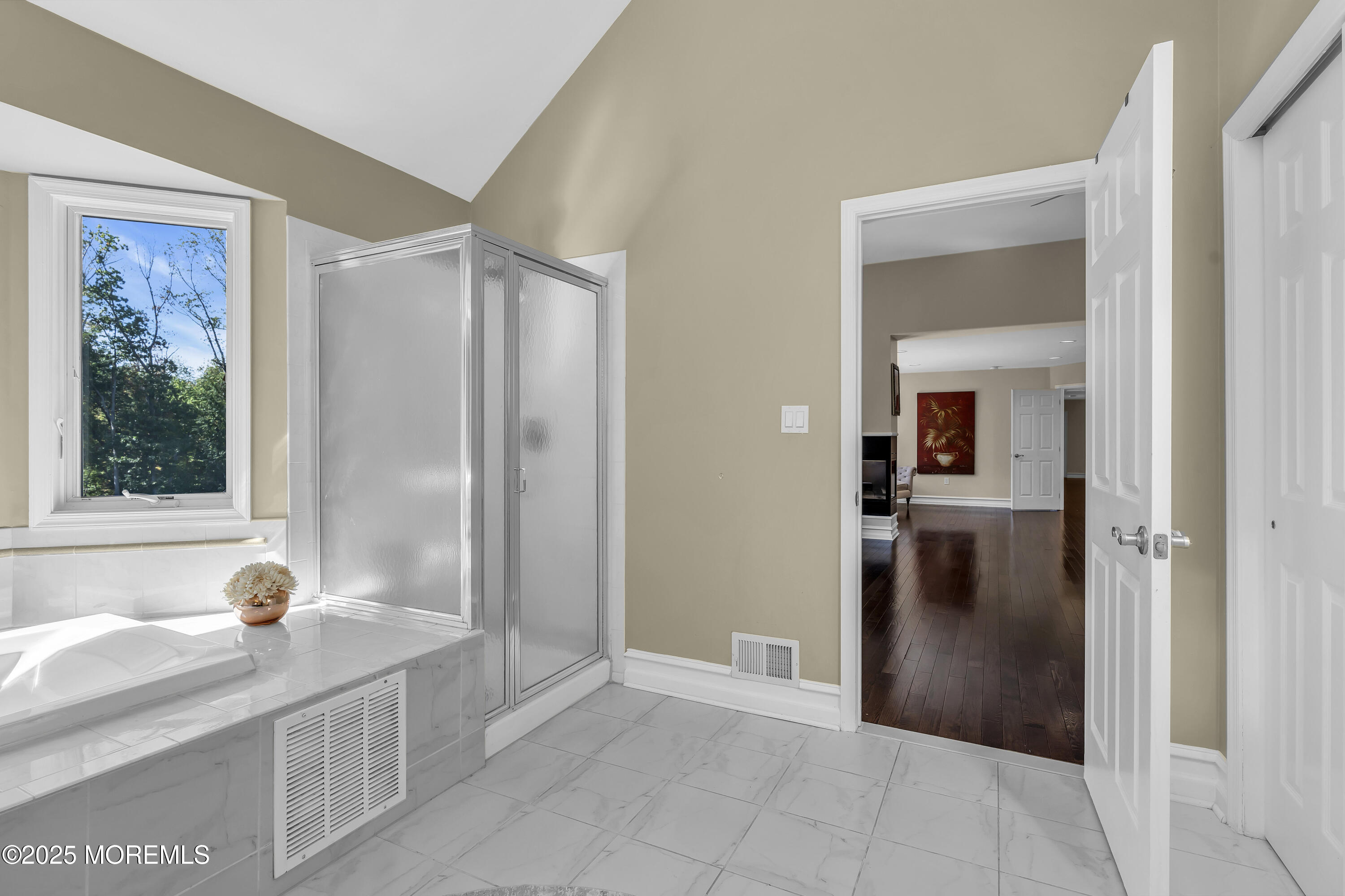 1 Fountayne Lane Manalapan, NJ 07726 - Photo 50 of 69 a bathroom with a tub and shower