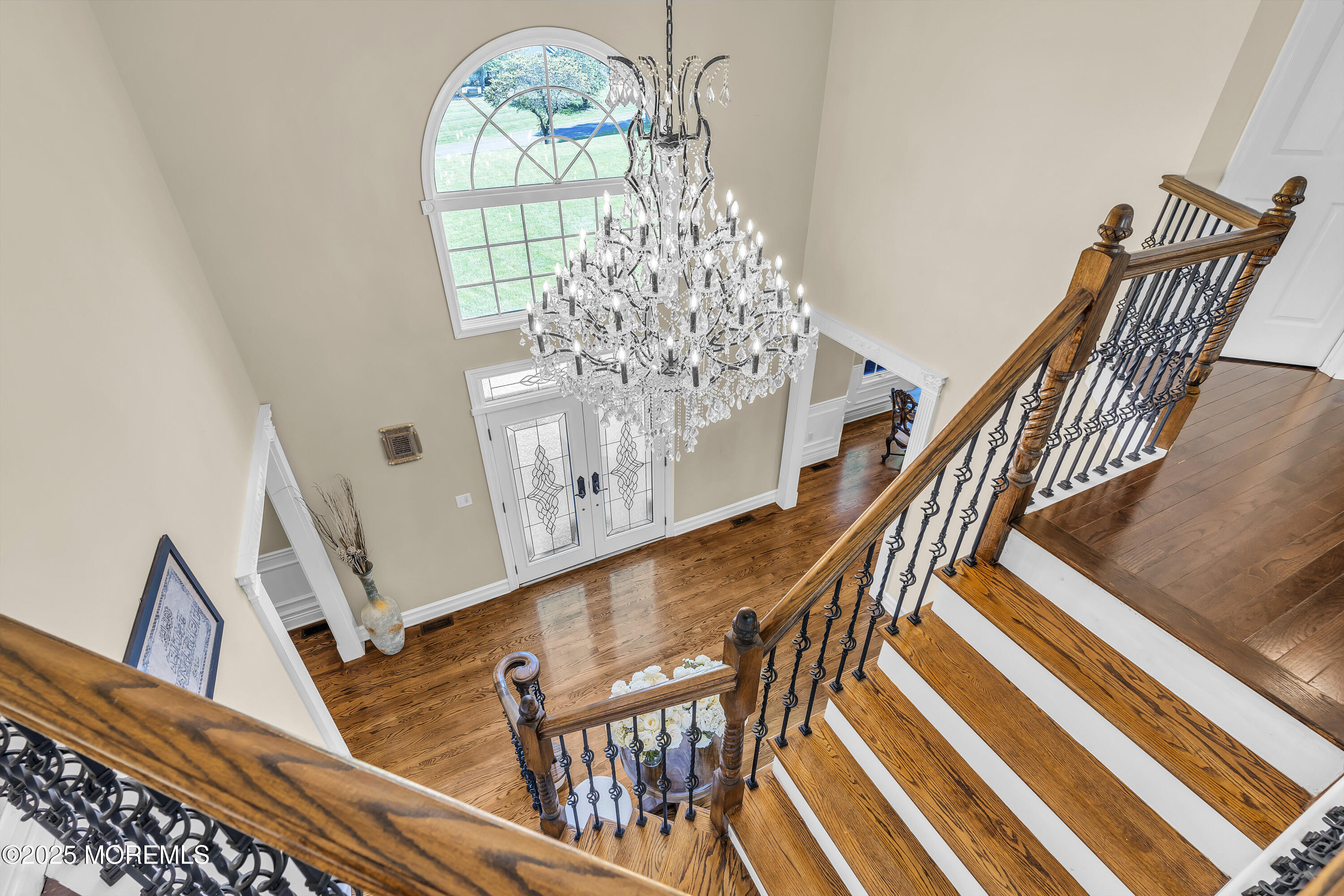 1 Fountayne Lane Manalapan, NJ 07726 - Photo 53 of 69 a view of entryway and hall with wooden floor