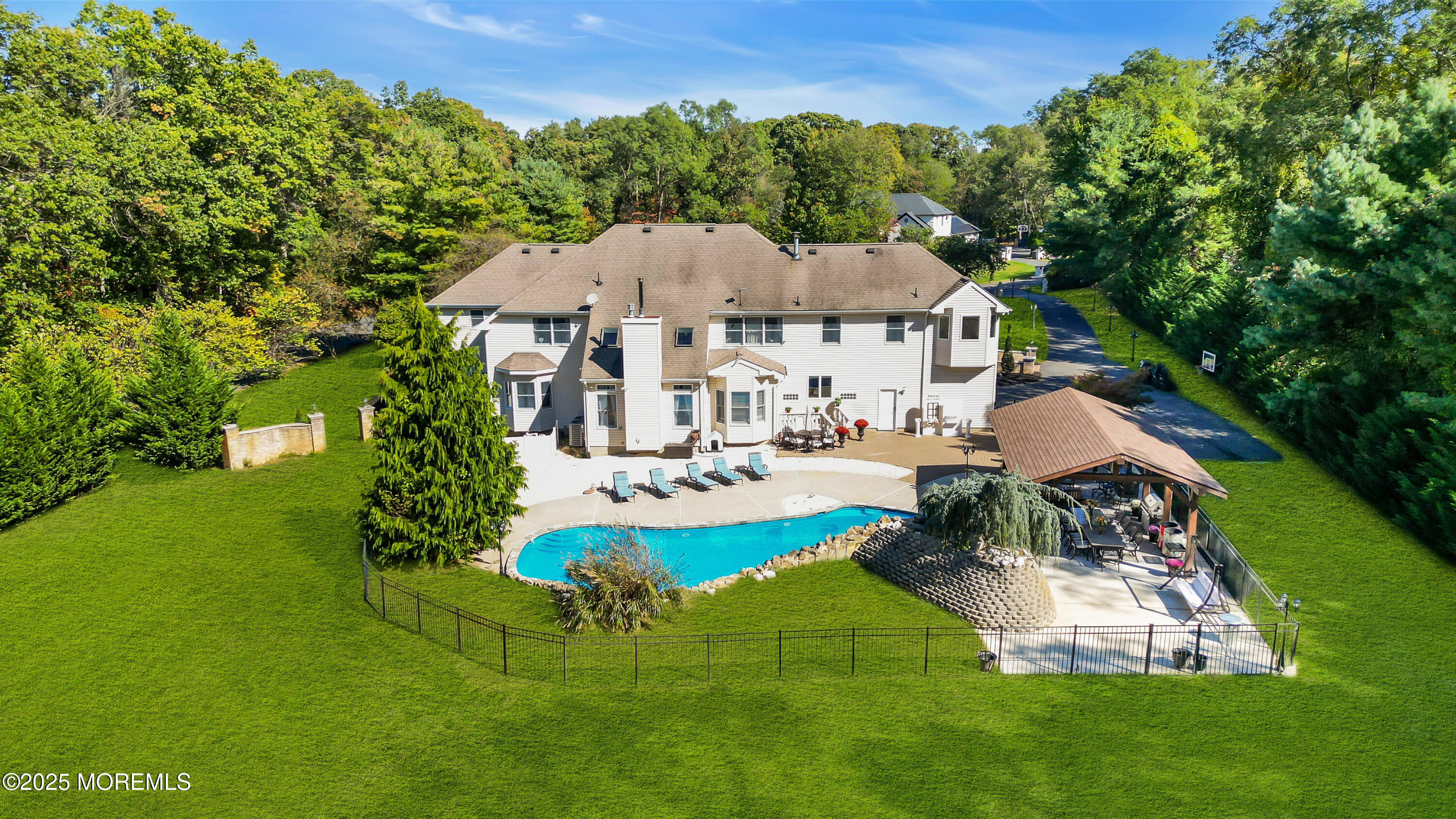 1 Fountayne Lane Manalapan, NJ 07726 - Photo 67 of 69 a view of a house with a yard and sitting area